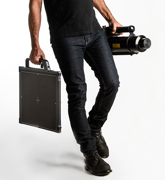 man holding digital xray equipment